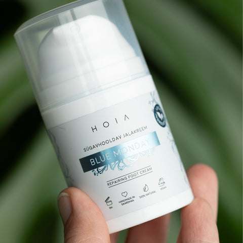 1. HOIA homespa Deep Care Foot Cream BLUE MONDAY, 50ml, held in hand, showcasing packaging design
