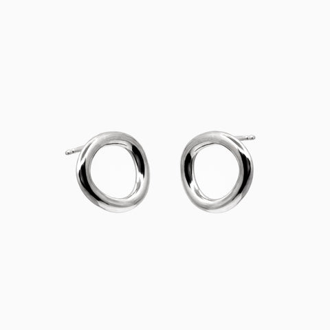 2. Studio image of Maarja Palu Earrings IRREGULAR x1 in polished silver with unique asymmetrical circular design