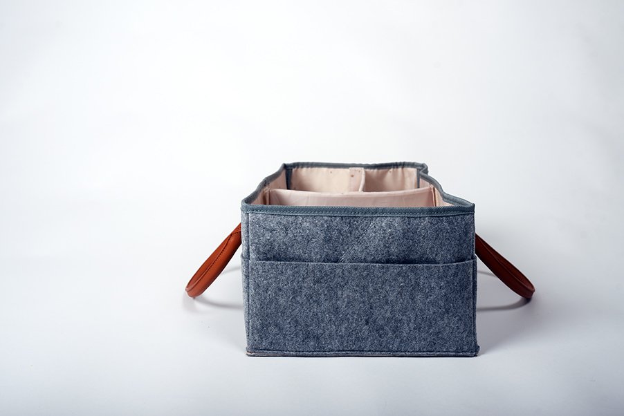 5. Side view of Ally Scandic storage basket in felt and PU leather, highlighting exterior pockets