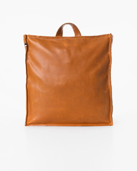 3. Back view of Trendbag Folk 2 Leather Backpack in caramel, highlighting smooth leather finish