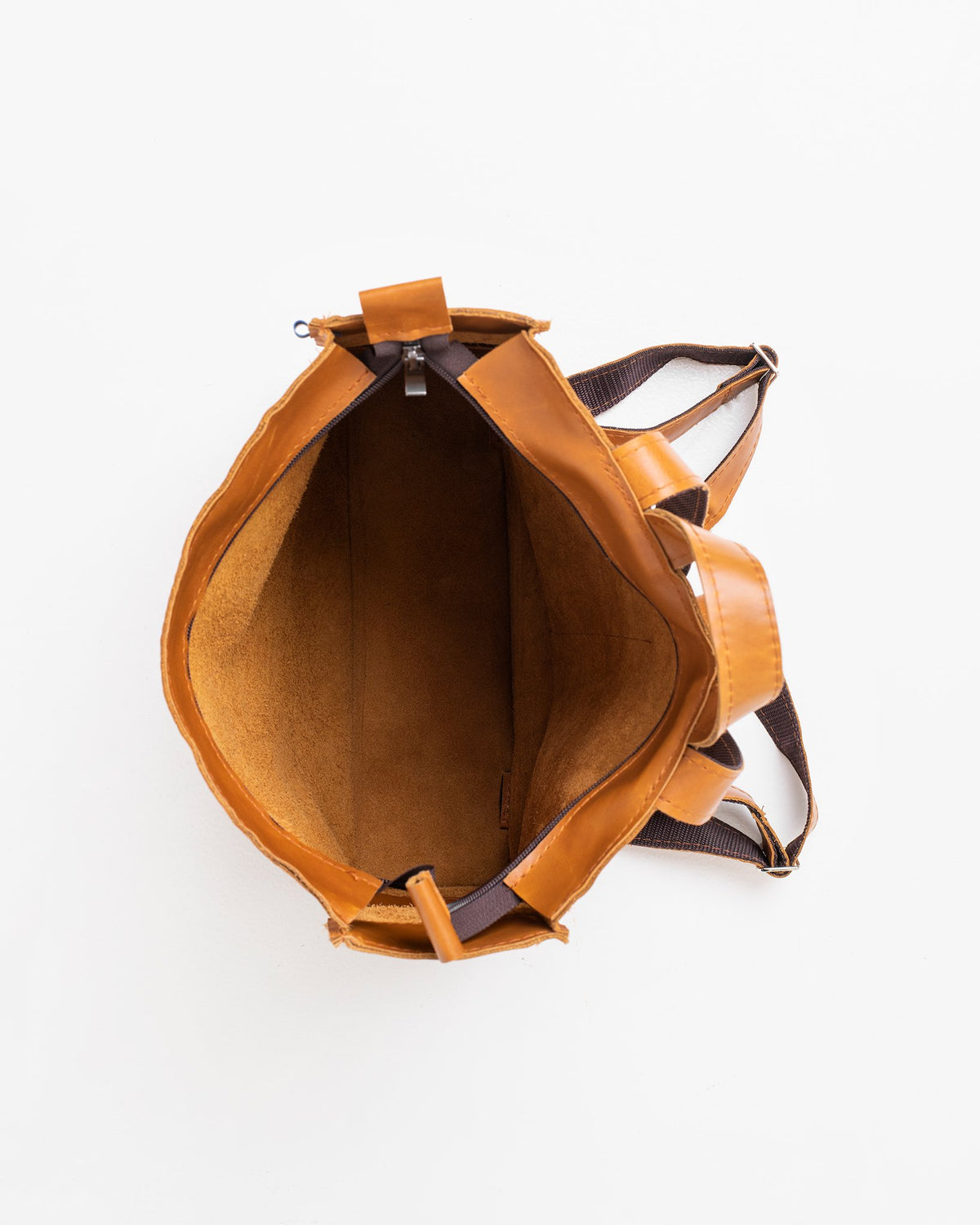 2. Top view of Trendbag Folk 2 Leather Backpack in caramel, showing spacious interior and open pockets