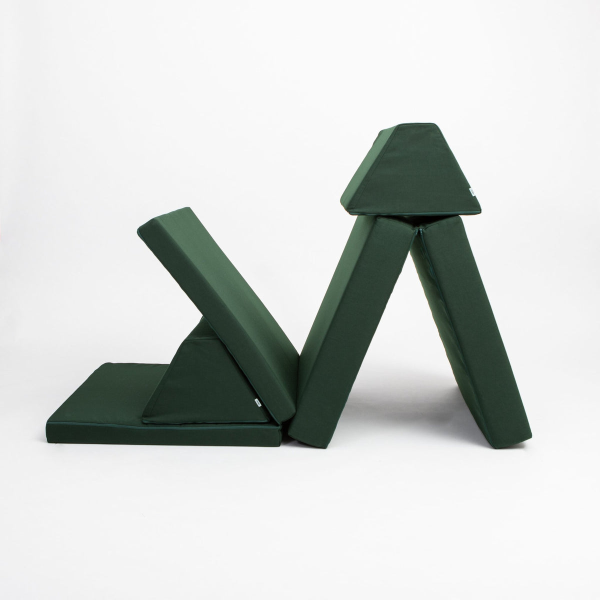 4. Monboxy deep green play mattress set in a creative folded structure on a white background