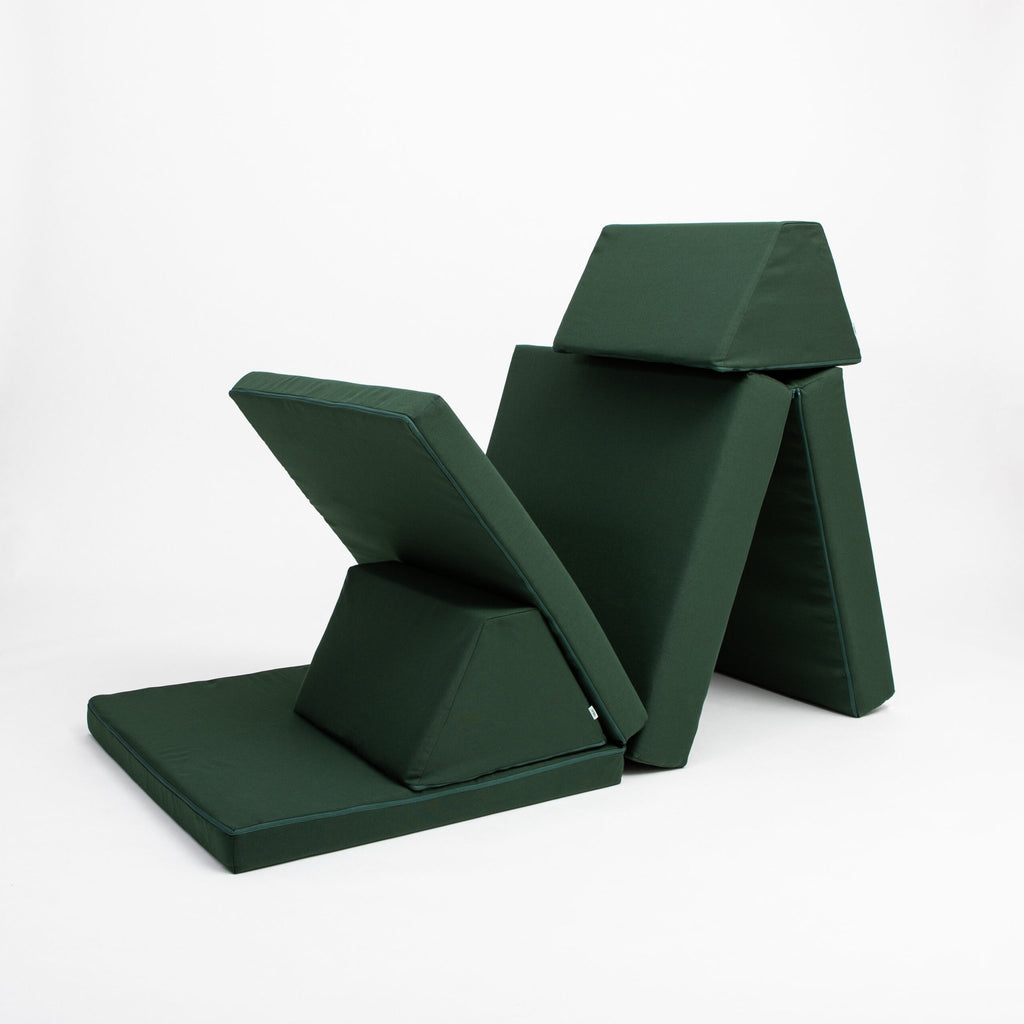 4. Monboxy deep green play mattress set with trapezoidal pillows in a folded arrangement