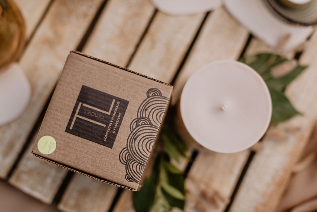 4. Close-up of TL Candles hand-made soy wax candle with amber pieces, highlighting packaging details