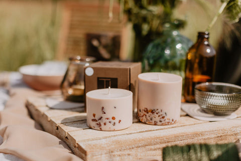 1. TL Candles hand-made soy wax candles with amber pieces, linden flower, and honey scent, displayed on a rustic outdoor table