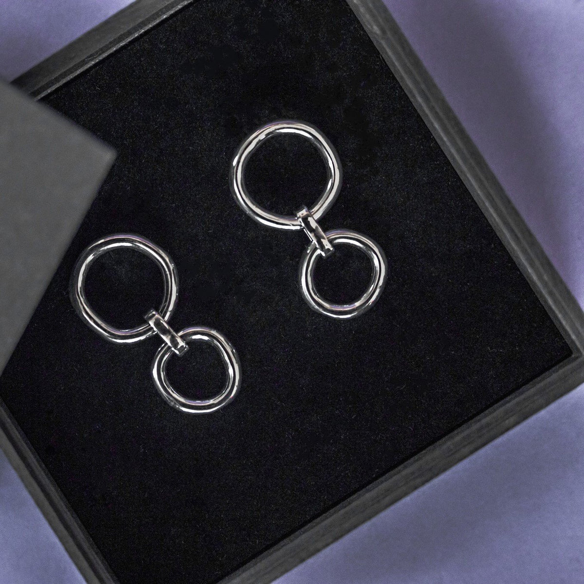2. Maarja Palu IRREGULAR x2 silver earrings with interlinked asymmetrical circles in black gift box