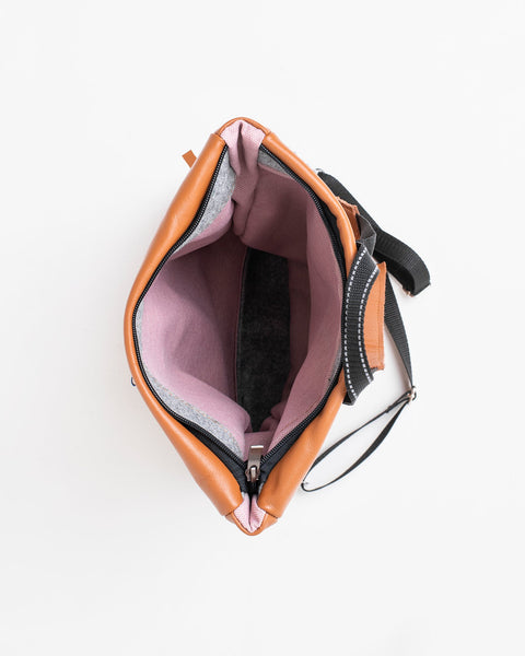 2. Interior view of Trendbag Barbara Leather Backpack in peanut, showing spacious main compartment and laptop section