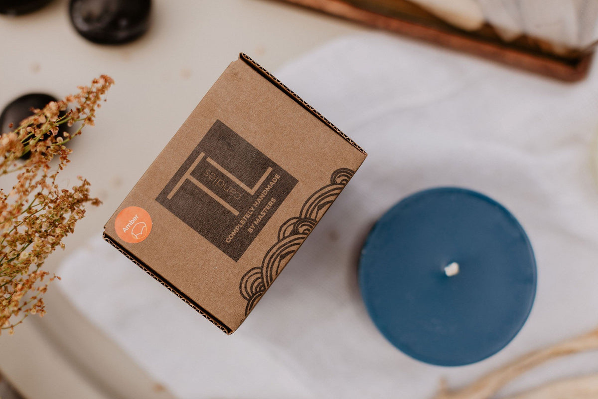 6. TL Candles branded packaging with hand-made blue soy wax candle, shown from above