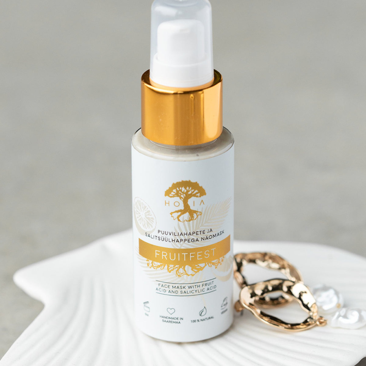 3. HOIA homespa Fruitfest Face Mask with fruit acids, 50ml bottle on a decorative plate with jewelry