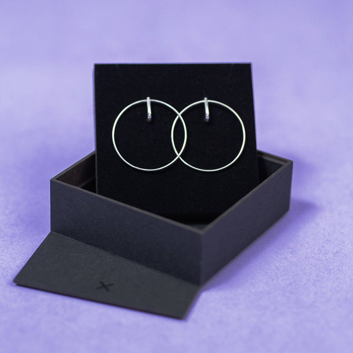 4. Maarja Palu LAYERS x1 large silver earrings displayed in open black gift box