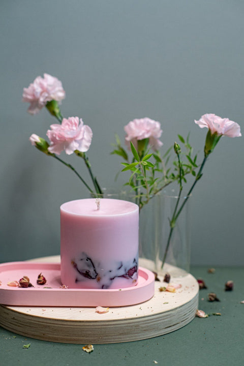 2. Single hand-made soy wax candle with peony scent by TL Candles, displayed with floral decor