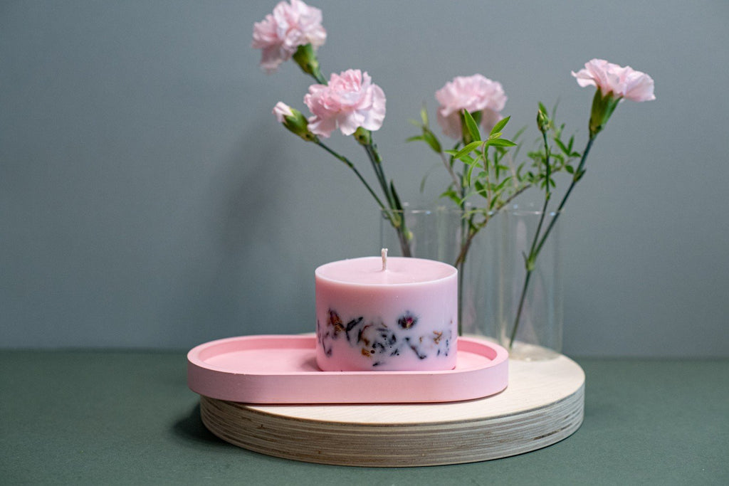 3. Small hand-made soy wax candle with peony scent by TL Candles, shown with flower petals