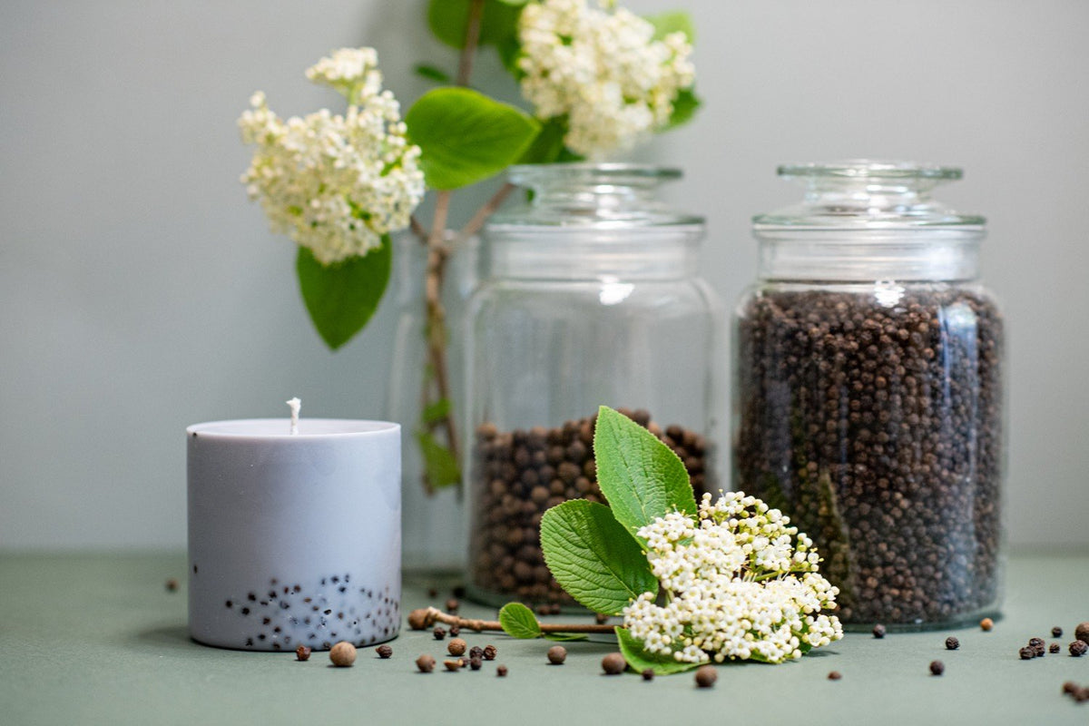 3. Hand-made soy wax candle by TL Candles, featuring patchouli scent, displayed with black pepper and myrtle