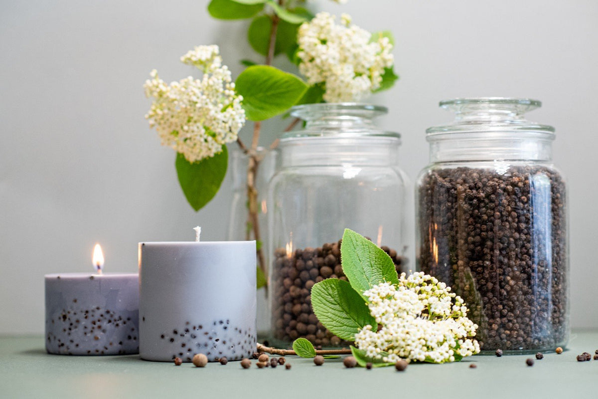 9. TL Candles hand-made soy wax candles with patchouli scent, styled with black pepper and myrtle, one candle lit