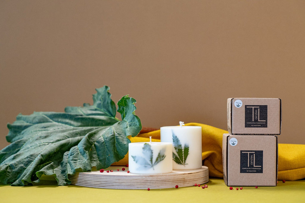 2. Pair of TL Candles soy wax candles with Clary Sage scent and hemp leaves, shown with branded packaging