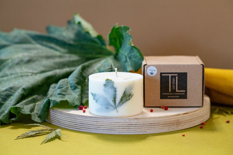 3. TL Candles soy wax candle with Clary Sage scent and hemp leaf, displayed with packaging on wooden base