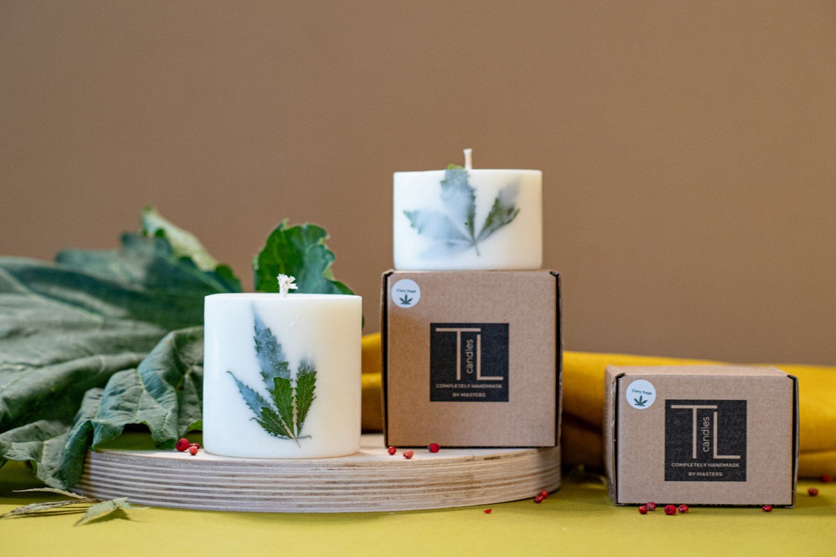 5. TL Candles soy wax candles with Clary Sage scent and hemp leaves, shown with packaging and wooden base