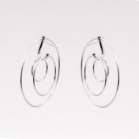 2. Studio image of Maarja Palu LAYERS x3 earrings featuring three interlocking silver circles