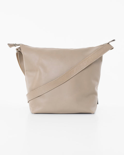 2. Back view of Trendbag Suvi XS shoulder bag in beige, highlighting smooth leather finish and strap