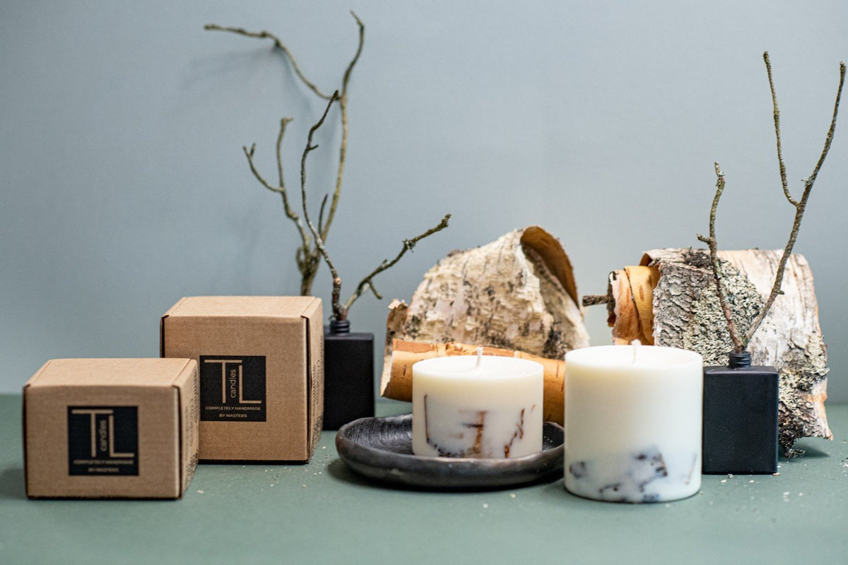 5. Pair of TL Candles hand-made soy wax candles with birch scent, shown with packaging and birch bark