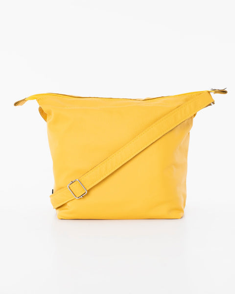 2. Trendbag Suvi XS yellow shoulder bag in studio, back view highlighting adjustable strap and sustainable leather craftsmanship