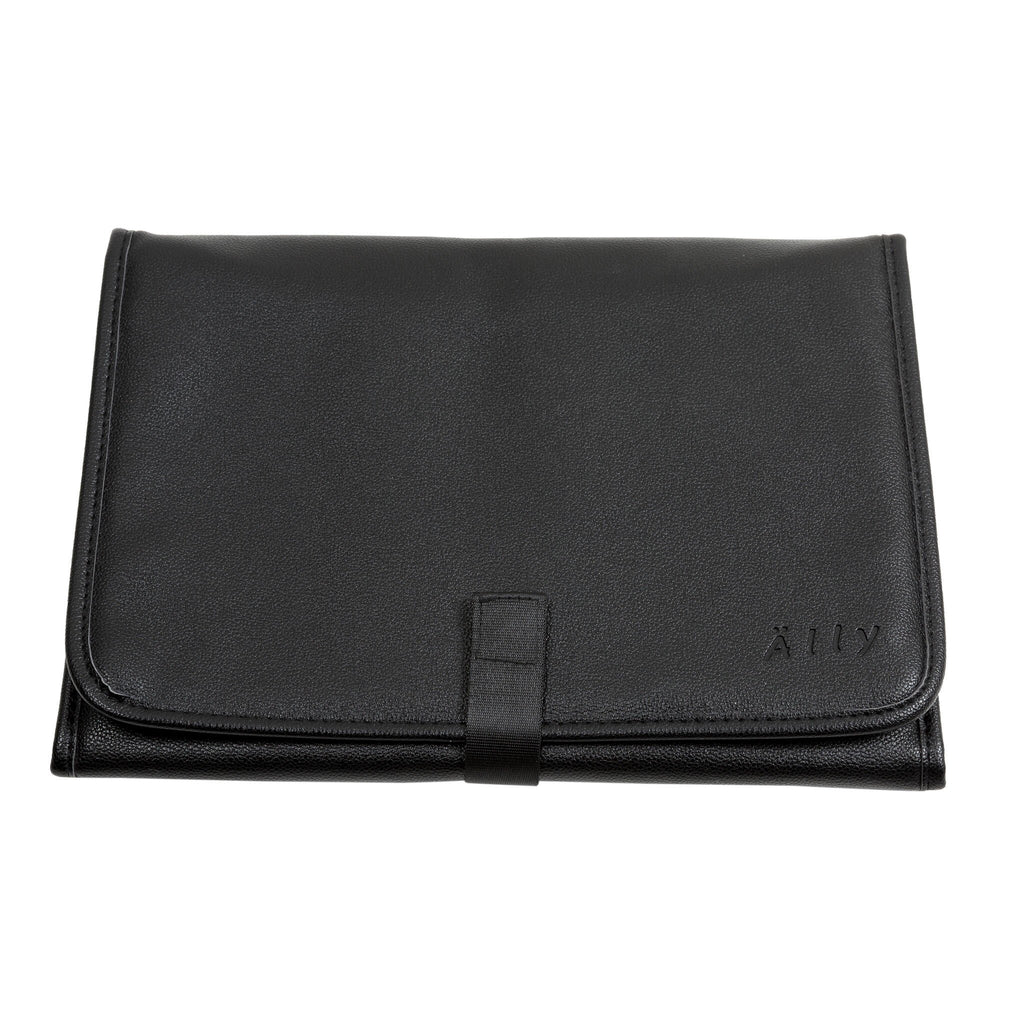 15. Folded black changing mat included with Ally Scandic Espresso Diaper Backpack