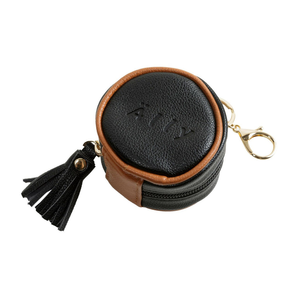 1. Black Ally Scandic pacifier bag with brown accents and tassel, shown in studio setting