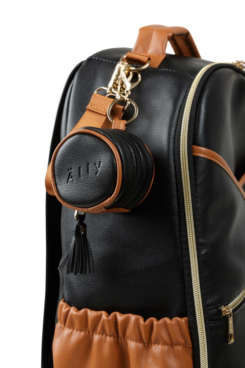 2. Black Ally Scandic pacifier bag attached to a matching black and brown bag, highlighting functionality