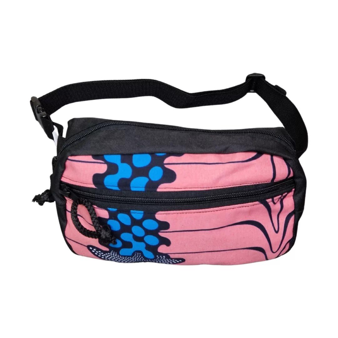 3. Drinbags TAIL OF THE WHALE dog treat bag in pink with blue pattern, side view with adjustable strap for versatile wear