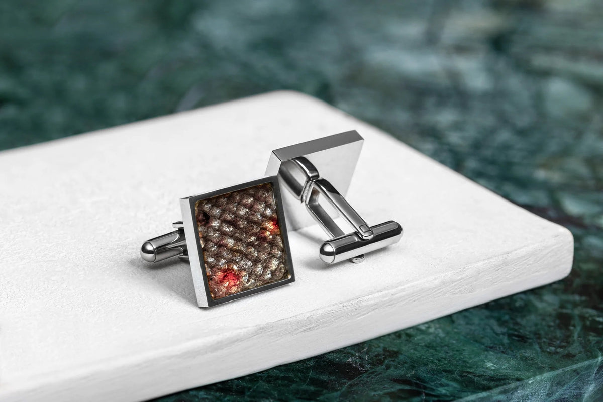 2. Pair of Eherüs square cufflinks featuring unique red-spotted brown trout leather pattern on white surface