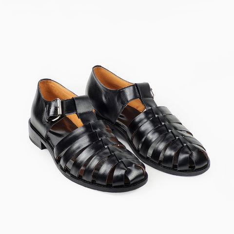 2. Studio image of men's black leather fisherman sandals with round toe and adjustable buckle by Daz Studio