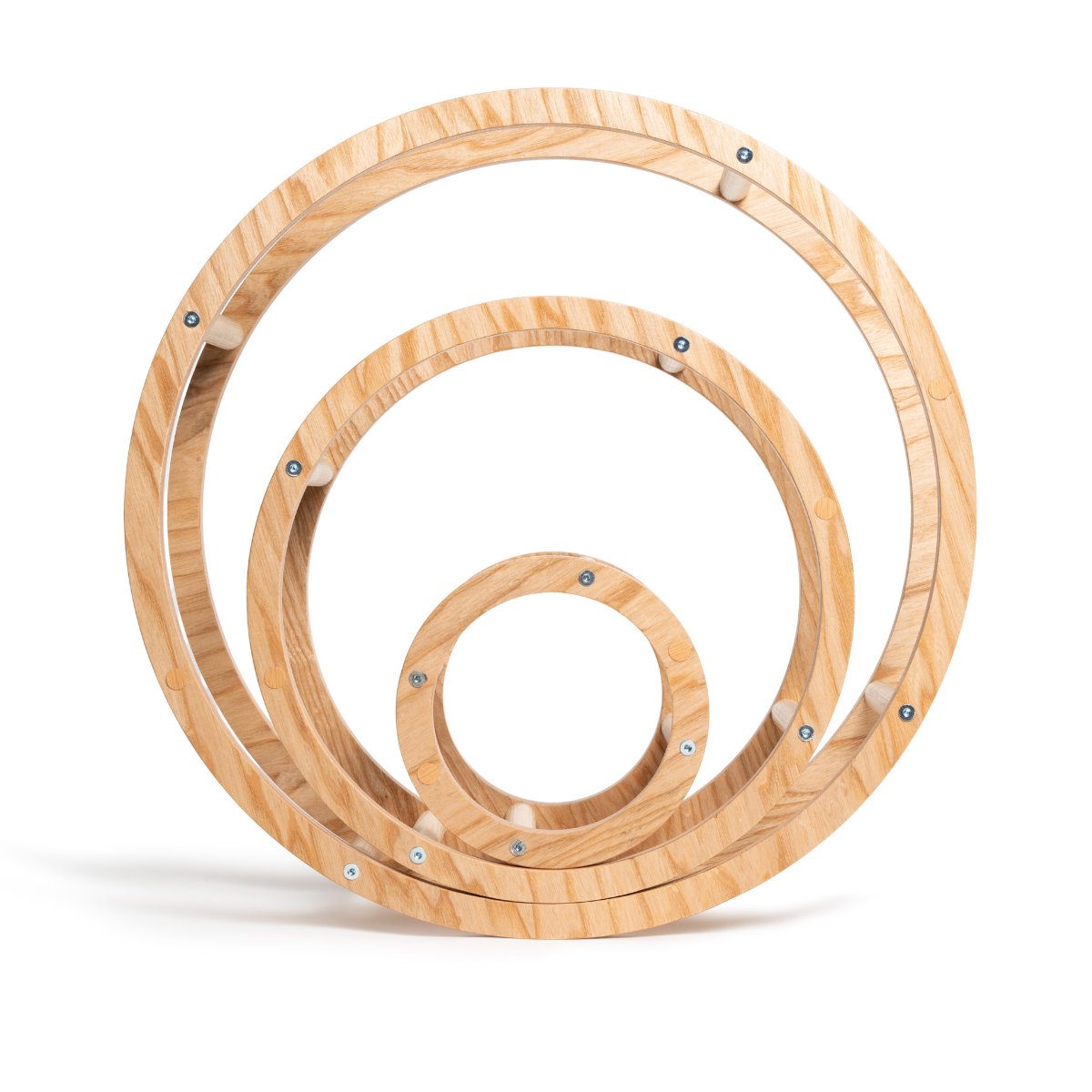 1. Set of three nested wooden rings in different sizes on white background, showcasing natural wood texture