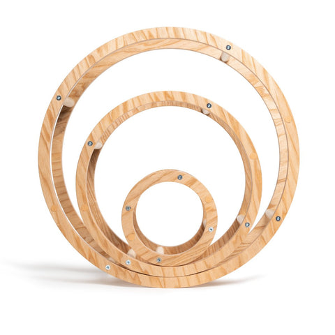 1. Set of three nested wooden rings in different sizes on white background, showcasing natural wood texture