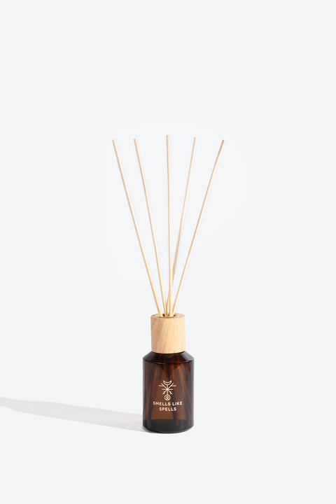 1. Smells Like Spells Thor home perfume with wooden reeds in amber glass bottle, studio setting