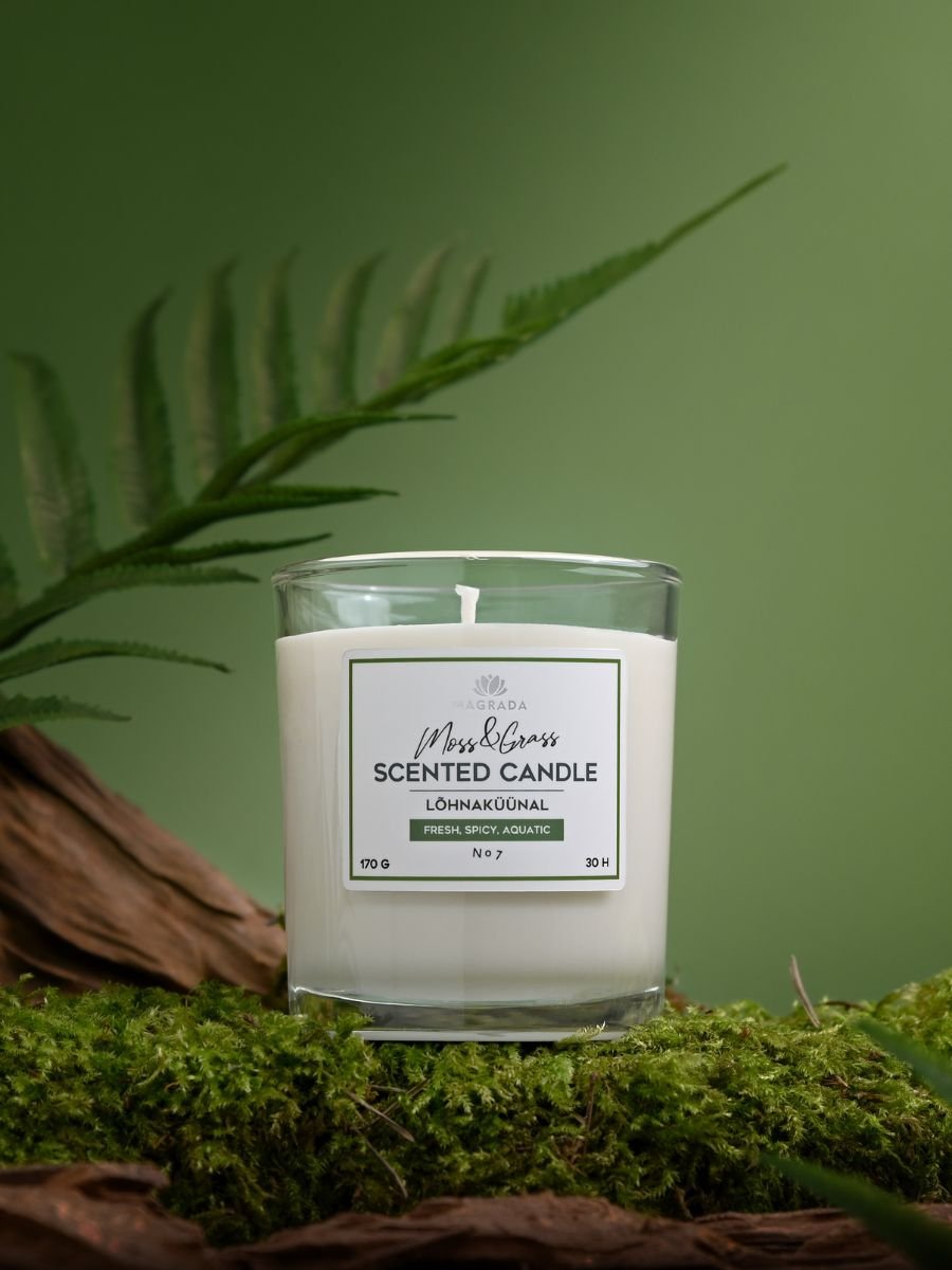 1. Magrada Organic Cosmetics Moss&Grass scented candle in glass jar on moss, showcasing fresh and spicy aroma