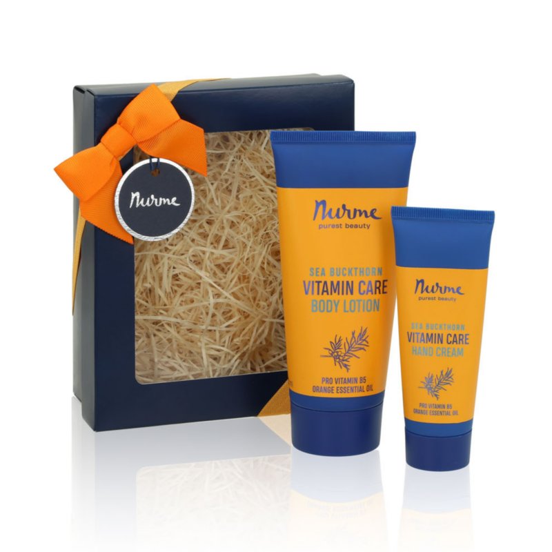 2. Nurme Sea Buckthorn-Orange body lotion and hand cream displayed outside gift box with orange ribbon