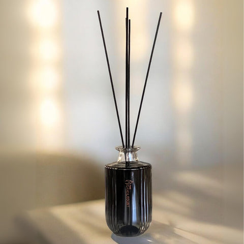 1. Luxurious Candledust Signature room diffuser with black fiber sticks on a table, creating a romantic atmosphere