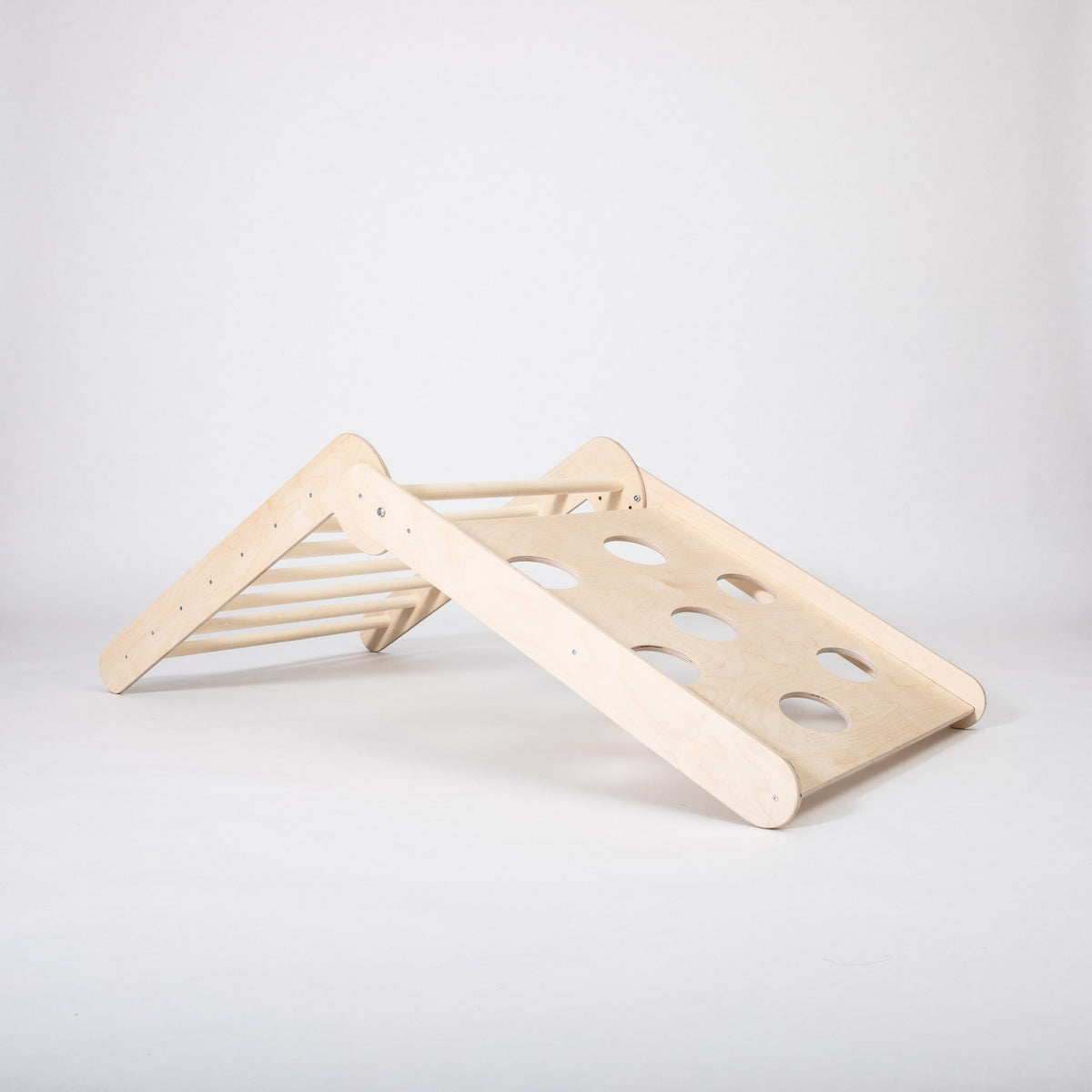 2. Studio shot of Montessori climbing triangle with climbing side visible on white background
