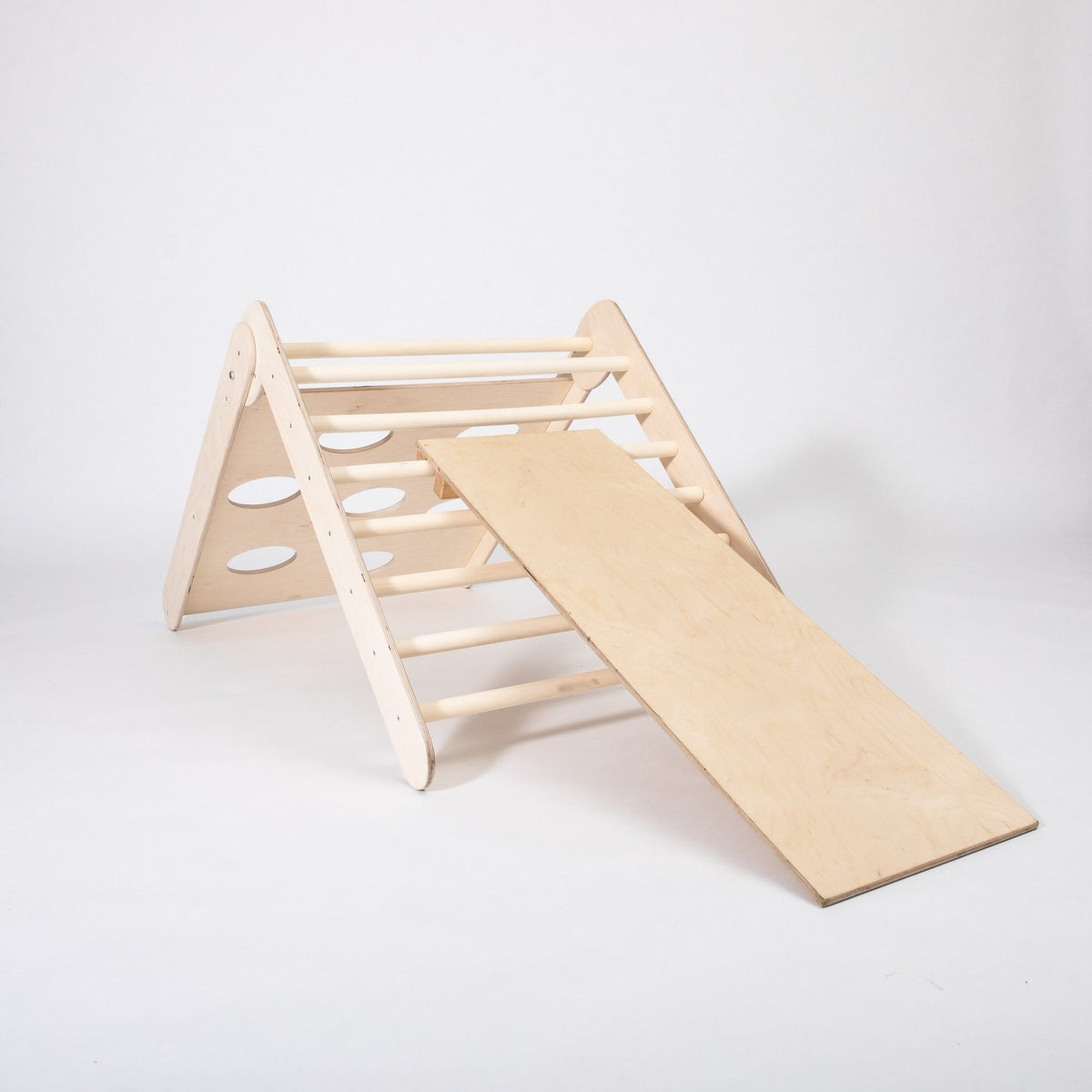 2. Studio shot of Montessori House Bed climbing triangle with ramp on white background, showing wooden construction and detachable ramp.