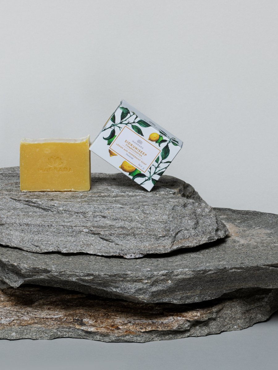 1. Magrada Organic Cosmetics lemon and mint soap with packaging on stone surface