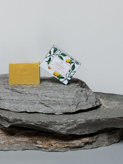 1. Magrada Organic Cosmetics lemon and mint soap with packaging on stone surface