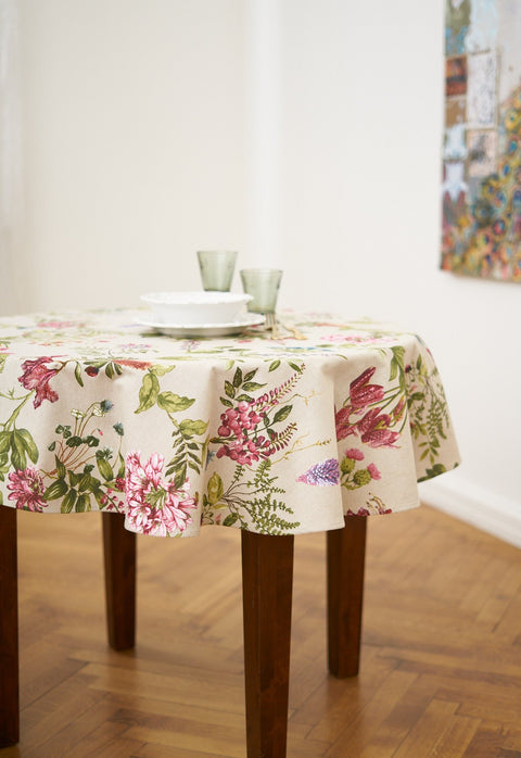 1. Hortensias Home Botanico round floral tablecloth on dining table, showcasing vibrant wild floral pattern in a dining room setting
