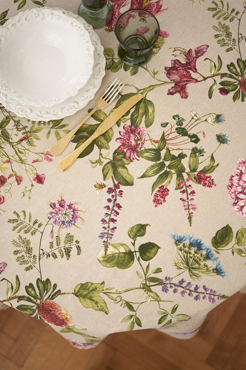 2. Top view of Hortensias Home Botanico round floral tablecloth with plates and cutlery, highlighting detailed floral design
