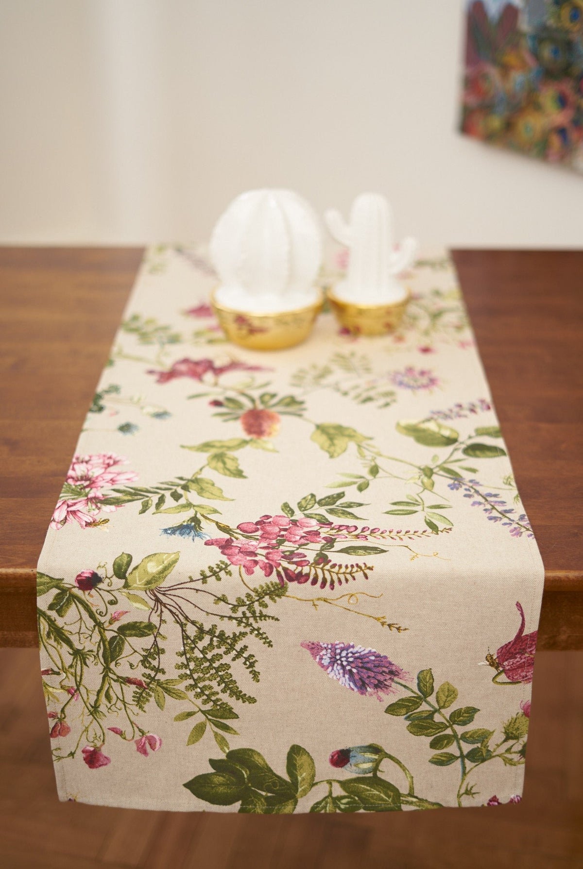 1. Hortensias Home Botanico table runner with floral print on dining table, lifestyle setting