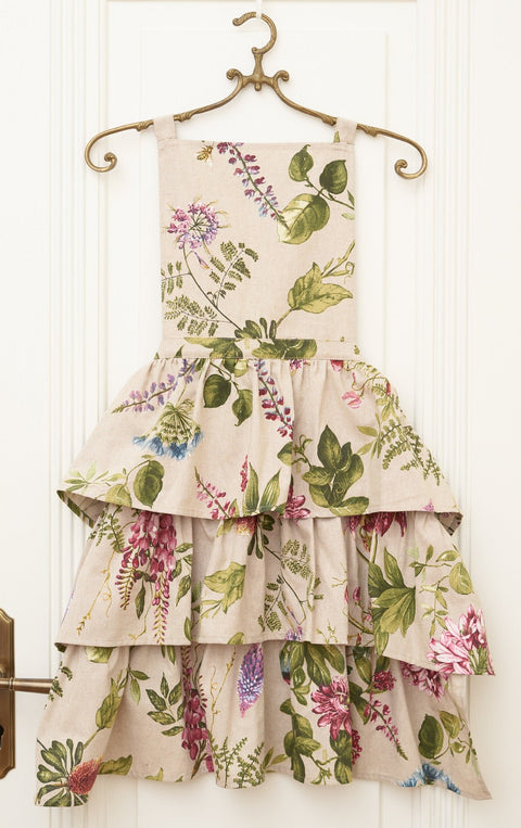 3. Studio shot of Hortensias Home Botanico floral ruffled apron on hanger