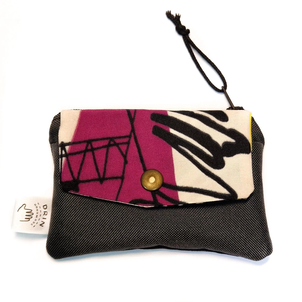1. Drinbags PAINT wallet with abstract design, featuring a metal press button and zipper closure, shown in studio