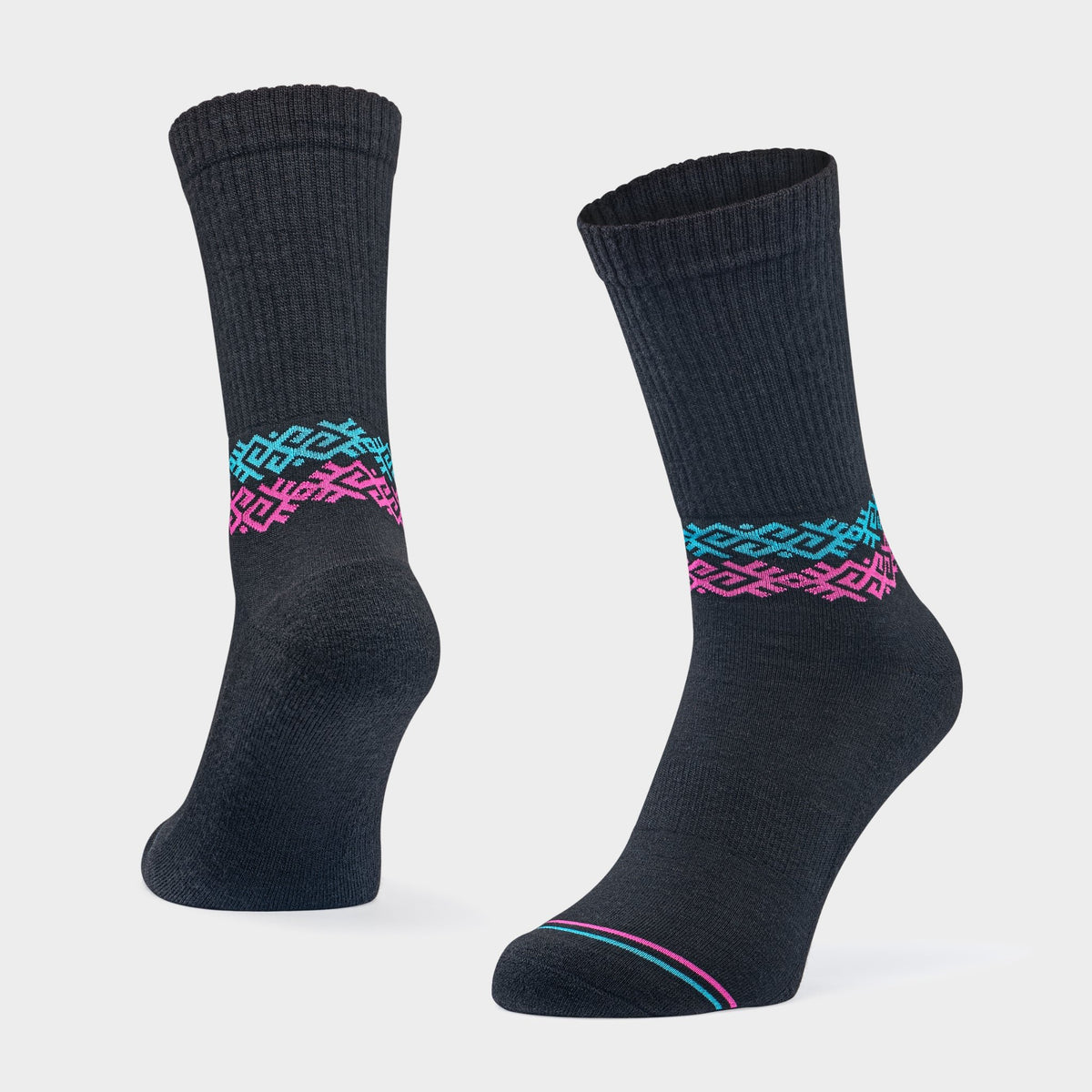 4. Studio shot of Baltland unisex black athletic cushioned Merino wool socks with ribbed cuff and colorful geometric pattern