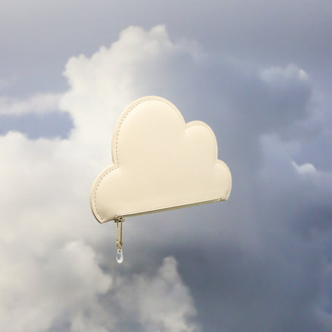 5. Tairi Roosve beige leather cloud purse with Swarovski crystal zip, side view in cloudy sky