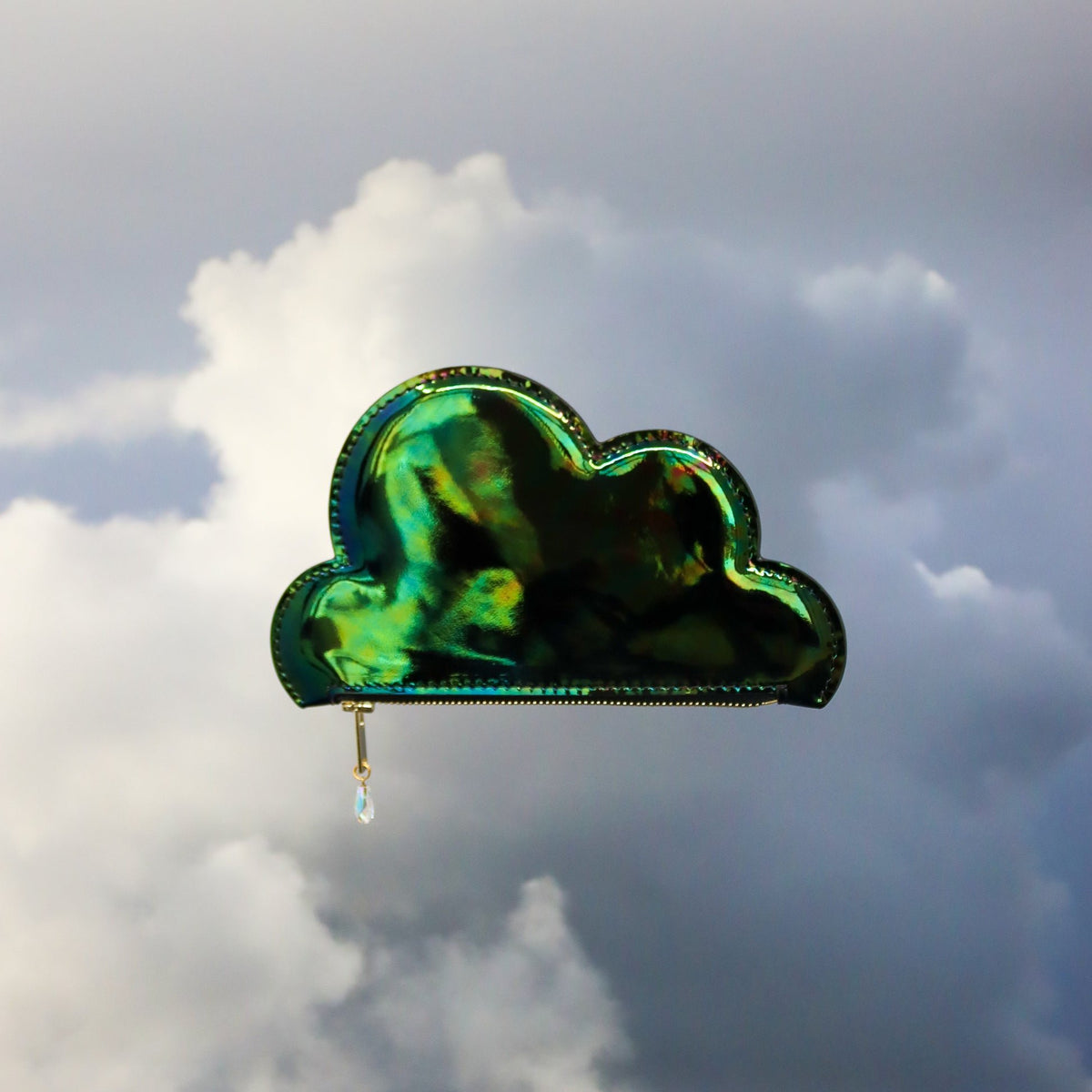 1. Tairi Roosve Leather Cloud Purse in iridescent green, floating against a cloudy sky