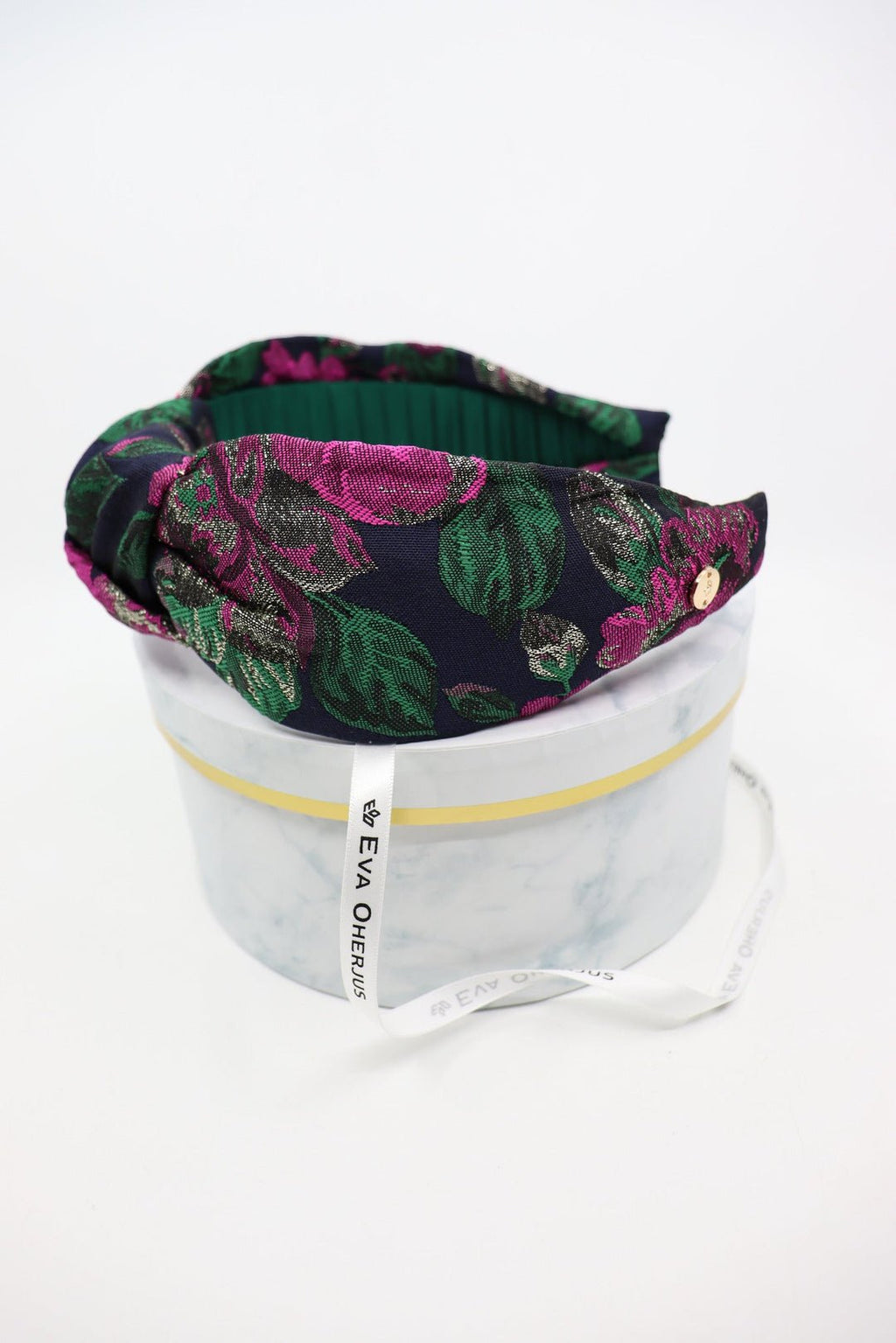 5. Knot Headband Flora by Eva Oherjus in luxury hat box, featuring fuchsia pink, green, and gold floral design